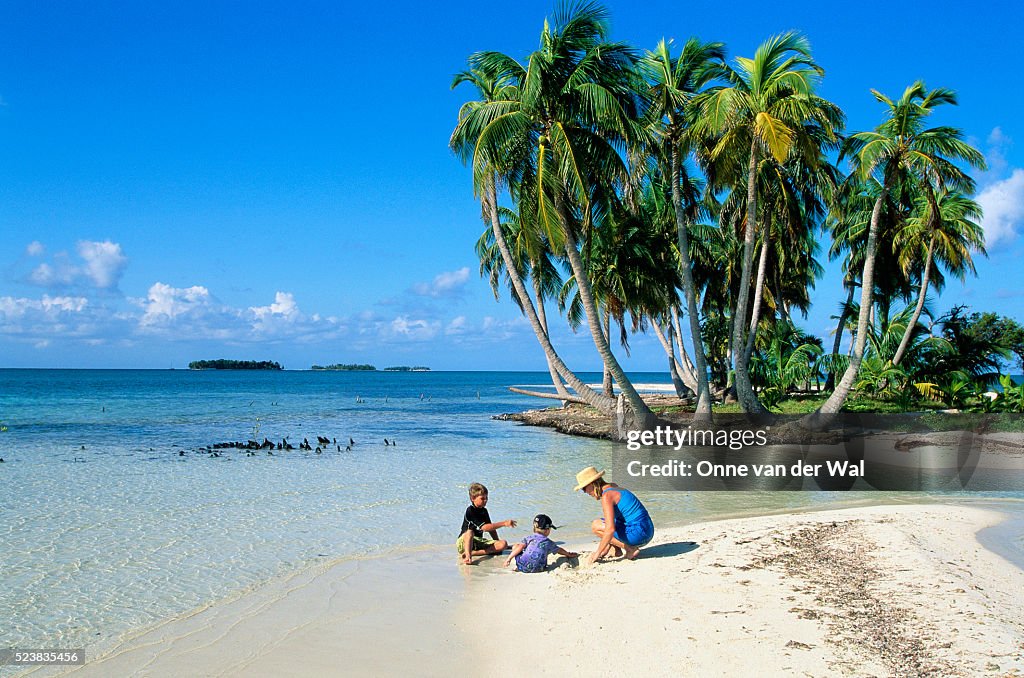 Family Playing on Belizean Beach