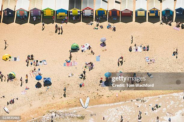 aerial view of holiday makers and beach huts on brighton beach, melbourne, victoria, australia - brighton beach melbourne - fotografias e filmes do acervo