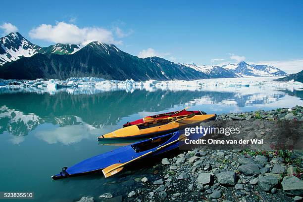 beached kayaks near icebergs in alaska - alaska coastline stock pictures, royalty-free photos & images