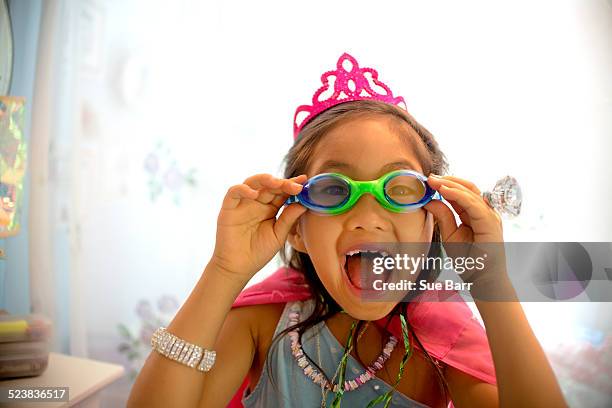 young girl wearing fancy dress costume, pulling face - swimming goggles stock pictures, royalty-free photos & images