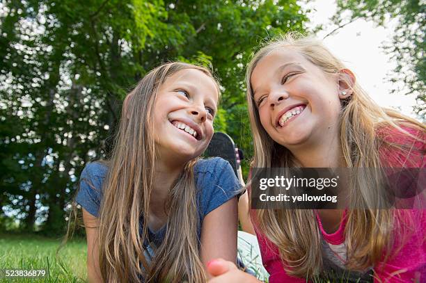 friends lying on grass - manchester vermont stock-fotos und bilder