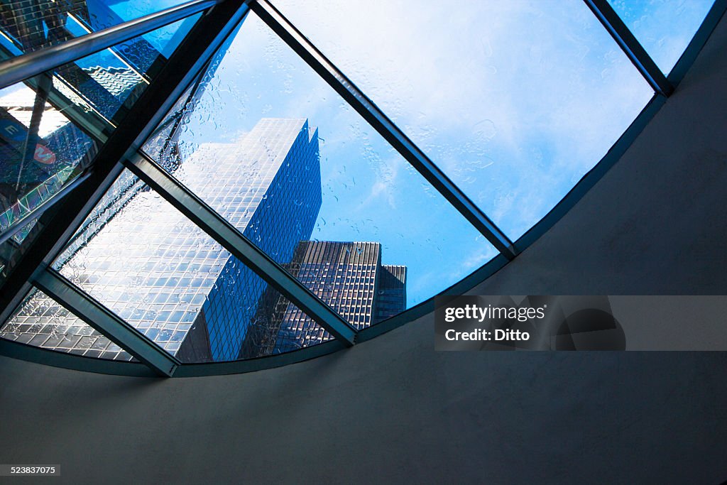 Skyscrapers from curved window in financial district, Manhattan, New York, USA