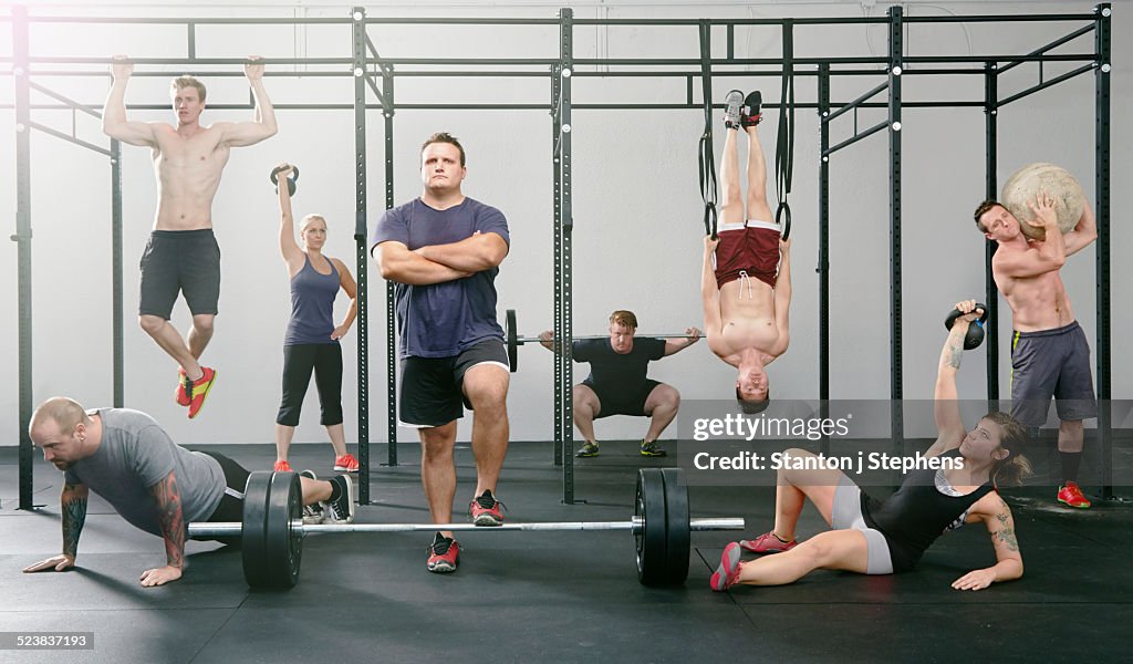 Portrait of eight male and female Gym colleagues active in gym