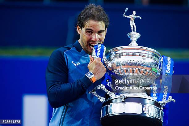 Rafael Nadal of Spain poses with the trophy after defeating Kei Nishikori of Japan in the final match during day seven of the Barcelona Open Banc...