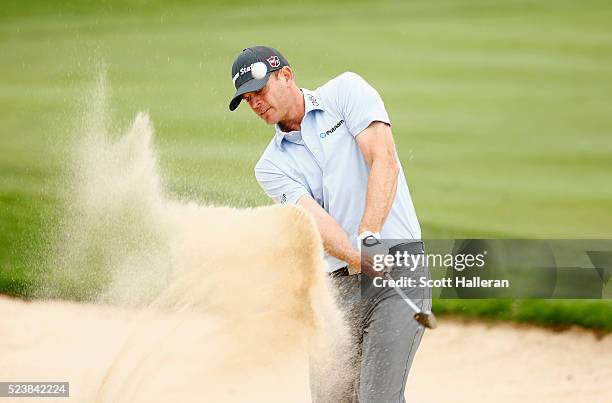 Brendan Steele takes his shot out of the bunker on the fifth hole during the final round of the Valero Texas Open at TPC San Antonio AT&T Oaks Course...