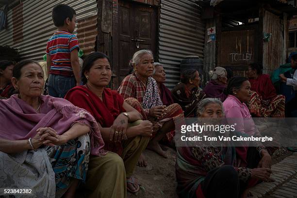Family members of earthquake victims attend a praying session during a Buddhist ceremony to commemorate the victims of last year's earthquake that...