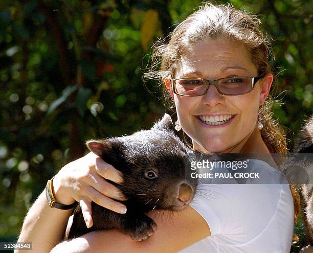 Crown Princess Victoria of Sweden smiles as she cuddles a baby wombat during a visit to Healsville Sanctuary near Melbourne, 14 March 2005. The crown...