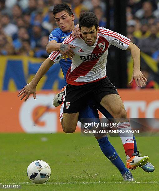 River Plate's midfielder Camilo Mayada vies for the ball with Boca Juniors's defender Jonathan Silva during the Argentina First Divison football...