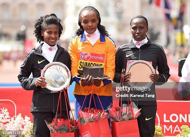 Womens winner Jemima Sumgong poses with 2nd place Tigist Tufa and 3rd place Florence Kiplagat during the Virgin London Marathon 2016 on April 24,...