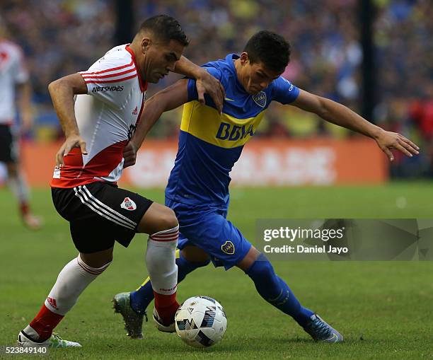 Jonathan Silva of Boca Juniors and Gabriel Mercado of River Plate fight for the ball during a match between Boca Juniors and River Plate as part of...