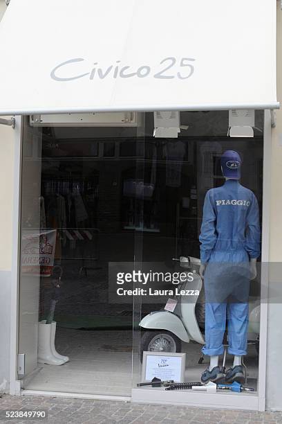 Shops in the city decorated with Vespa for the celebration of 70 years of the Vespa scooter on April 24, 2016 in Pontedera, Italy. Vespa was born on...