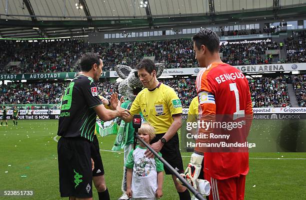 Martin Stranzl of Moenchengladbach and goalkeeper Diego Benaglio of Wolfsburg shake hands with referee Wolfgang Stark prior to the Bundesliga match...