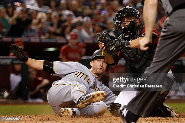 David Freese of the Arizona Diamondbacks reacts after being tagged out at home plate by catcher Welington Castillo of the Arizona Diamondbacks during...