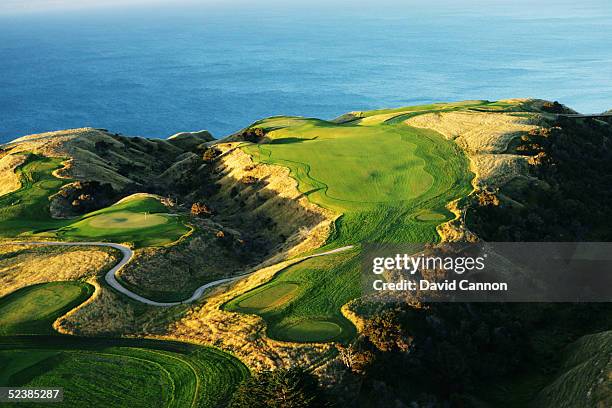 The par 3 11th hole and the par 4 12th hole with the par 3 13th hole in the distance at Cape Kidnappers, on January 11 in Hawkes Bay, New Zealand.