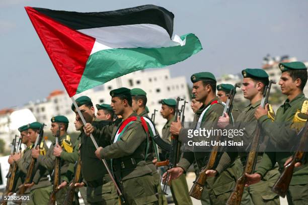 Palestinian honor guard police officers practise at the Palestinian Authority headquarters March 14, 2005 in the West Bank city of Ramallah. U.S....