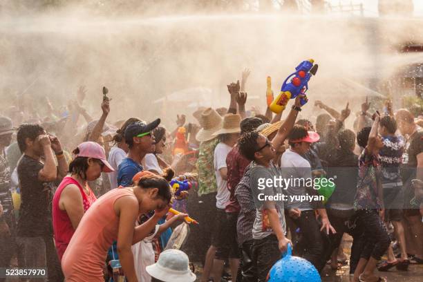 people celebrate in songkran festival day - songkran stock pictures, royalty-free photos & images