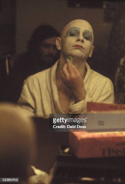 Scottish mime artist and dancer Lindsay Kemp adjusts his make-up in his dressing room during a run of the play 'Flowers' at the Bush Theatre, London,...
