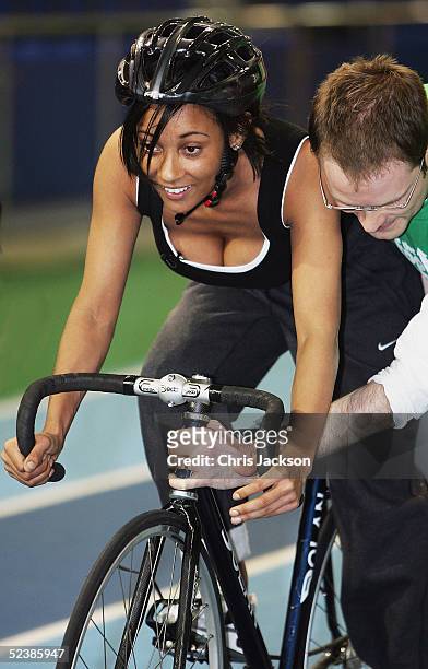 Pop star Lisa Maffia is assisted during a cycling training session ahead of the new series of the reality TV show The Games, at the English Institute...