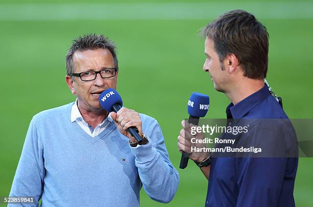 Head coach Norbert Meier of Bielefeld speaks with sport reporter Claus Lufen of WDR prior to the Second Bundesliga Playoff Second Leg match between...