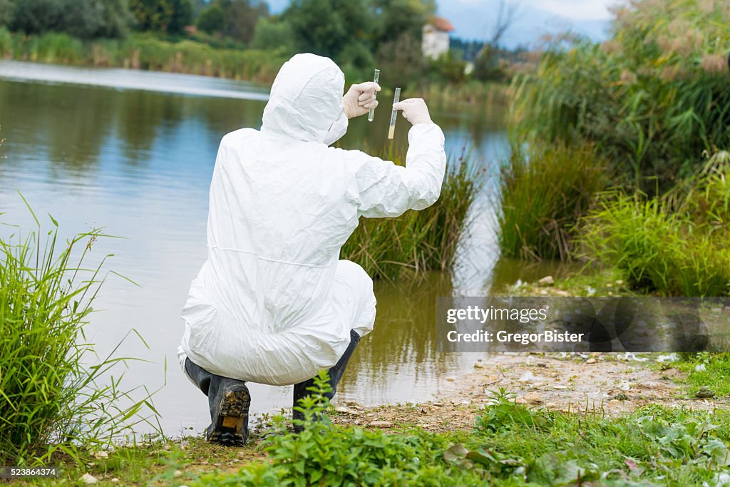 Scientist examing toxic water