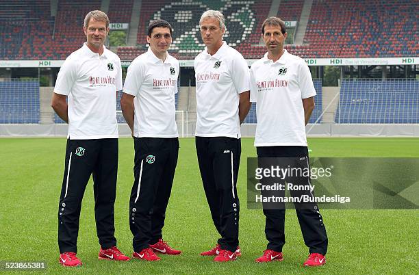 Goalkeeping coach Joerg Sievers, head coach Tayfun Korkut and the assistant coaches Xaver Zembrod and Julen Masach of Hanover pose during the...