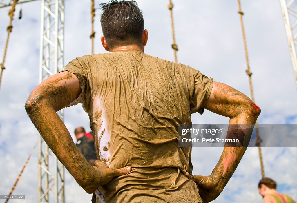 5K competitor assessing obstacle.