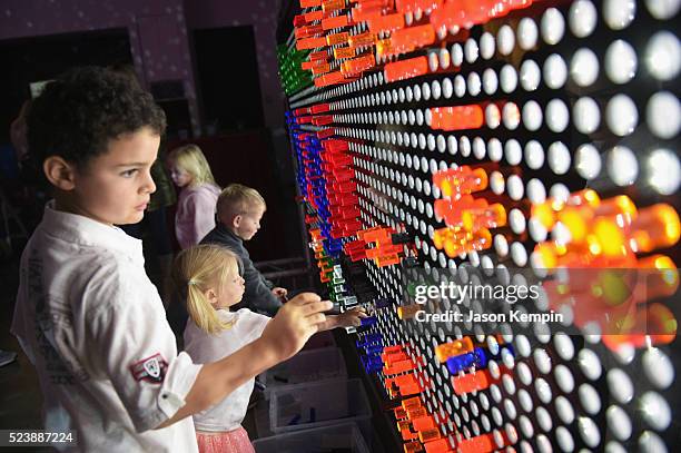 Children interact with play stations during Safe Kids Day 2016 presented by Nationwide at Smashbox Studios on April 24, 2016 in Los Angeles,...