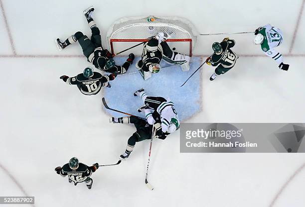 Shot by Alex Goligoski of the Dallas Stars gets past Devan Dubnyk of the Minnesota Wild to score a goal during the third period of Game Six of the...