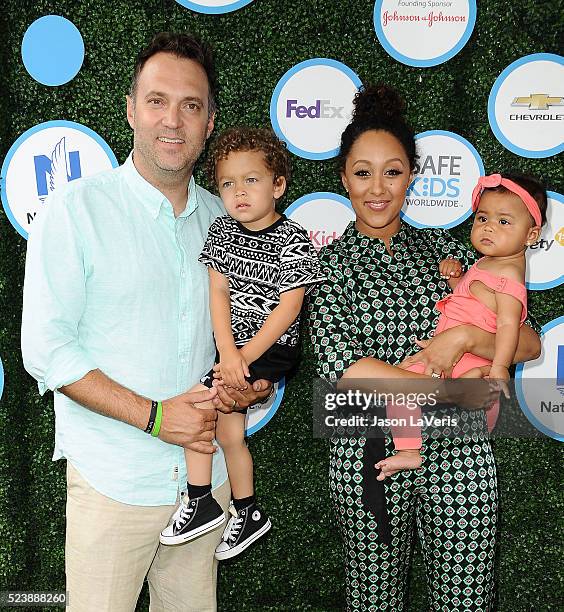 Adam Housley, Aden John Tanner Housley, Tamera Mowry and Ariah Talea Housley attend Safe Kids Day at Smashbox Studios on April 24, 2016 in Culver...