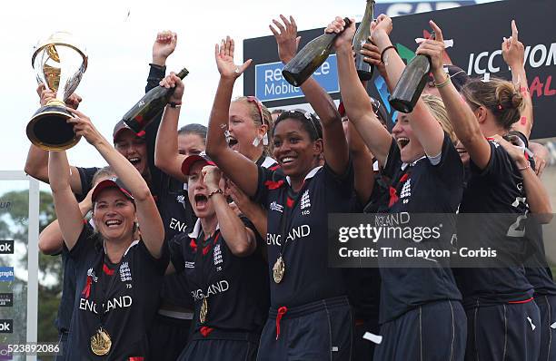 England Captain Charlotte Edwards holds the trophy as she celebrates with team mates after her teams victory in the ICC Women's World Cup Cricket...