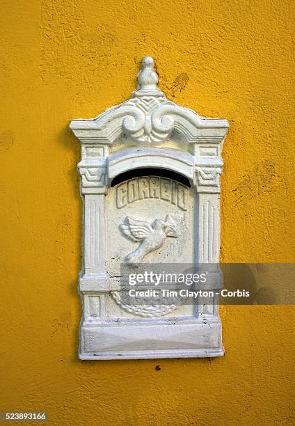 Letterboxes in the walls of properties high in the hills of the Santa Teresa district of Rio de Janeiro, Brazil. 22nd July 2010. Photo Tim Clayton..