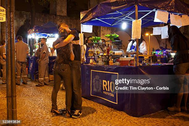 Night life around the Lapa Aquaduct, Rio de Janeiro, a popular location on Friday and Saturday night and a cheaper alternative for revellers heading...