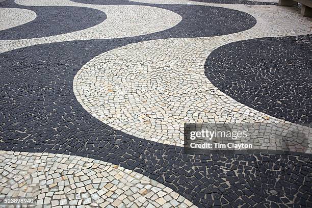 The pavement pattern of the sidewalk on Copacabana beach, Rio de Janeiro, Brazil. 16th July 2010. Photo Tim Clayton..