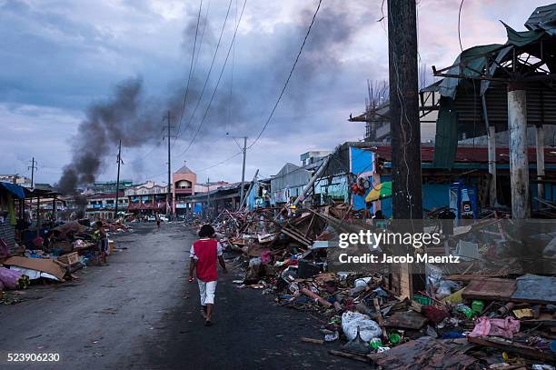 Dusk sets in amidst the rubble at the Tacloban city public market. More than two weeks have passed after Super Typhoon Haiyan caused widespread...