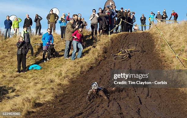 Mike Kelly falls from his bike and slides down the muddy hillside during the thrills and spills of the New Zealand Cyclocross Championships sponsored...