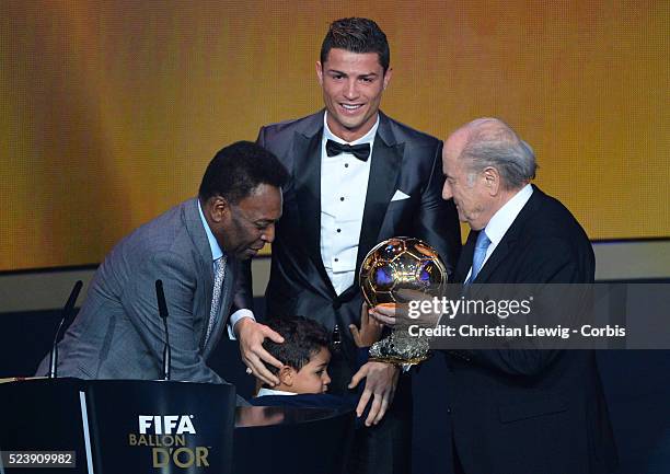 Ballon d'Or winner Cristiano Ronaldo of Portugal and Real Madrid looks on with son Cristiano Ronaldo Junior during the FIFA Ballon d'Or Gala 2013 at...