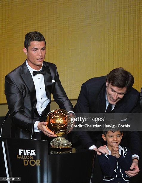 Ballon d'Or winner Cristiano Ronaldo of Portugal and Real Madrid looks on with son Cristiano Ronaldo Junior during the FIFA Ballon d'Or Gala 2013 at...