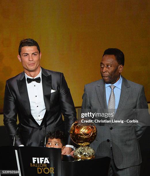 Ballon d'Or winner Cristiano Ronaldo of Portugal and Real Madrid looks on with son Cristiano Ronaldo Junior during the FIFA Ballon d'Or Gala 2013 at...