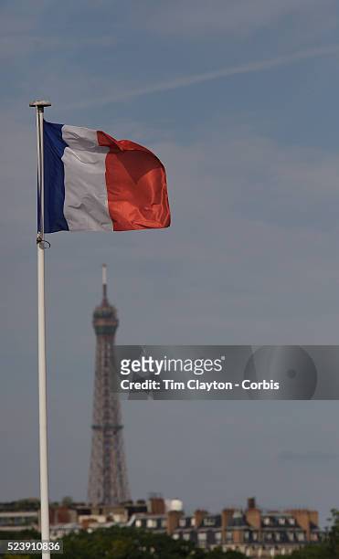 "The french flag flies above the stadium at Roland Garros with the Eiffel Tower in the background during the French Open Tennis Tournament Finals...