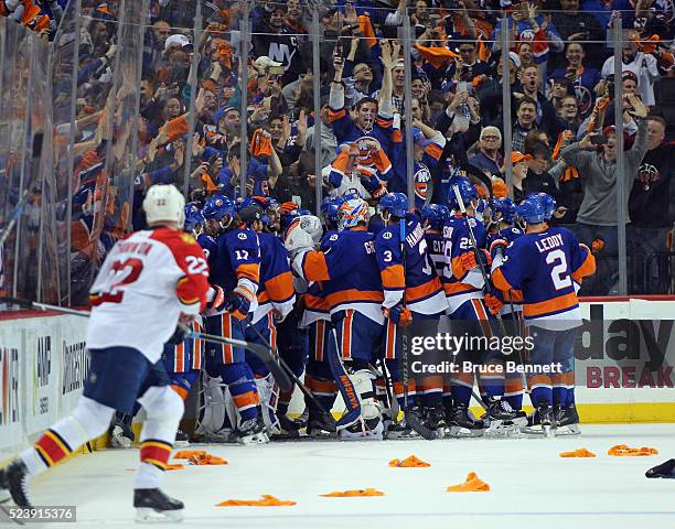 The New York Islanders celebrate a 2-1 double overtime victory over the Florida Panthers in Game Six of the Eastern Conference First Round during the...