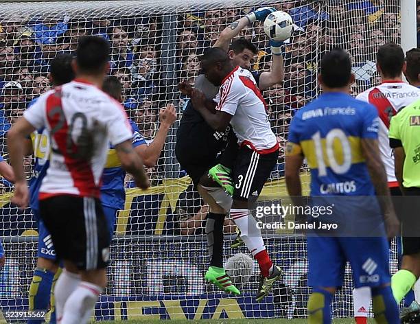 Eder Balanta, of River Plate, crashes into Agustin Orion, of Boca Juniors, during a match between Boca Juniors and River Plate as part of Torneo...