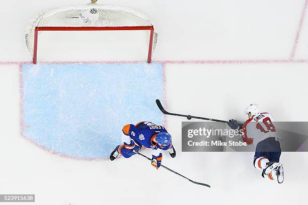 Nick Leddy of the New York Islanders defends the net against Reilly Smith of the Florida Panthers in Game Six of the Eastern Conference First Round...