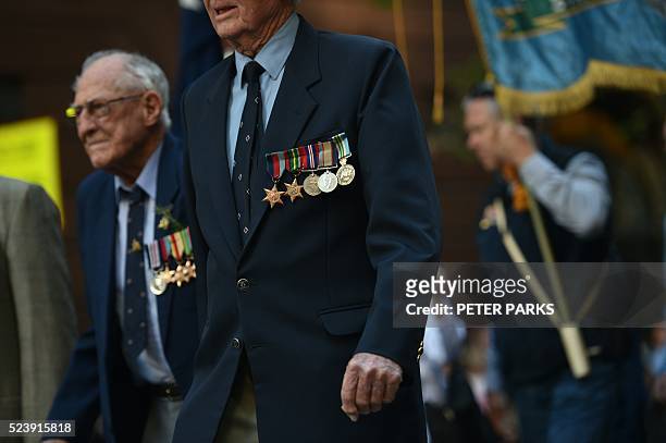 War veterans take part in the ANZAC parade to mark the centenary of the Gallipoli landings in Sydney on April 25, 2016 Thousands attended moving dawn...