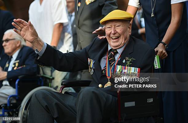 War veteran waves to the crowds derung the ANZAC parade to mark the centenary of the Gallipoli landings in Sydney on April 25, 2016 Thousands...