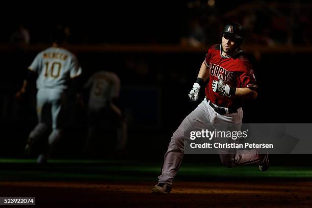 Chris Owings of the Arizona Diamondbacks runs to third base on a RBI triple hit against the Pittsburgh Pirates during the eighth inning of the MLB...