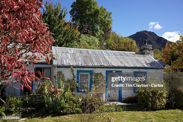 Autumn in Arrowtown. .Dudley's Cottage at the end of town. Arrowtown is the much visited, historic, 4-season, southern hemisphere holiday...