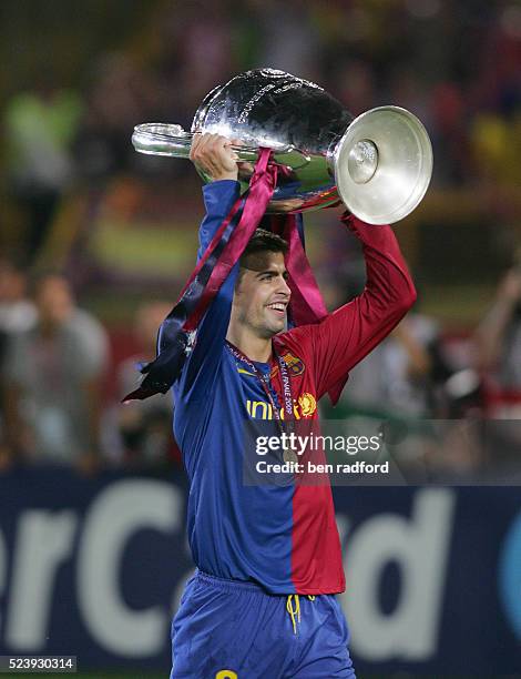 Gerard Pique of Barcelona celebrates with the trophy after the UEFA Champions League Final between Barcelona and Manchester United at the Stadio...