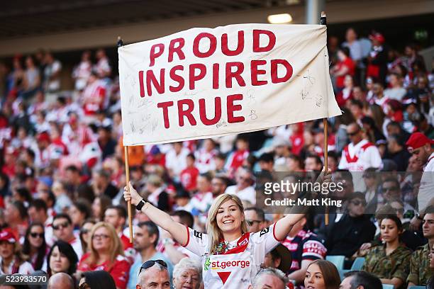 Dragons fan holds a banner during the round eight NRL match between the St George Illawarra Dragons and the Sydney Roosters at Allianz Stadium on...