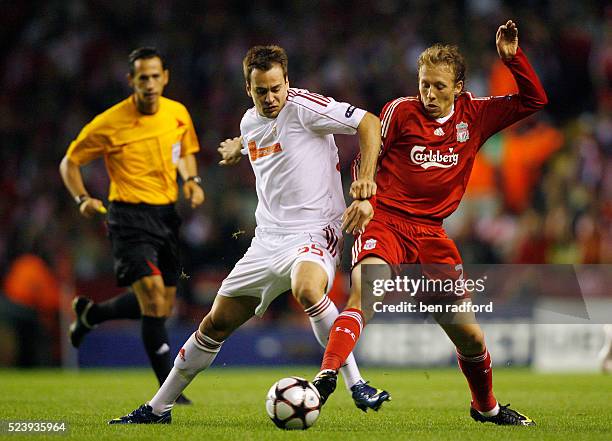 Lucas of Liverpool and Peter Szakaly of Debreceni VSC during the UEFA Champions League Group E match between Liverpool and Debreceni VSC at Anfield...