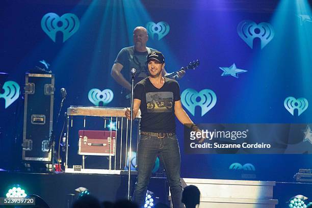 Luke Bryan performs onstage during iHeartRadio Country Festival in Austin at the Frank Erwin Center on March 29, 2014 in Austin, Texas.